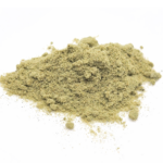 Close-up of Gorilla Glue Kief with a golden, powdery texture and visible trichomes